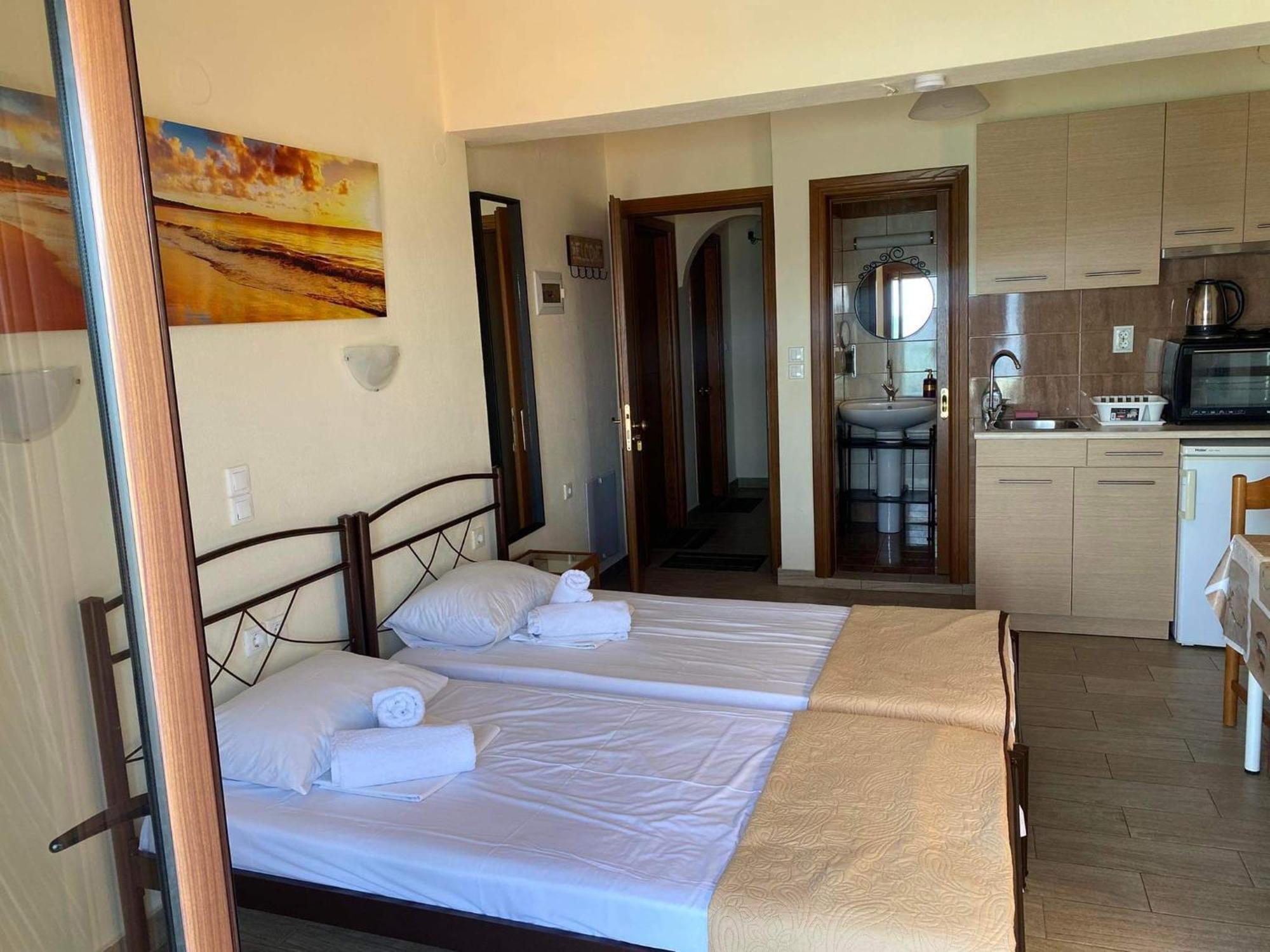 Diolkos Apartement Nea Roda Bilik gambar